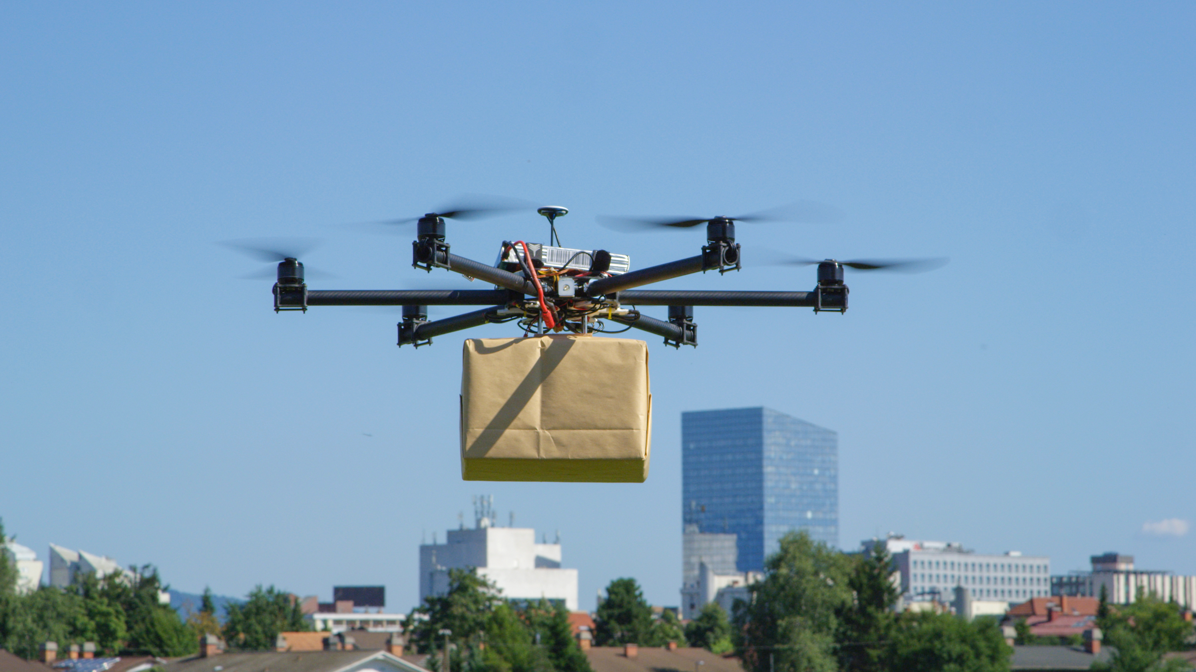 Drone package delivery Drone delivering a package.