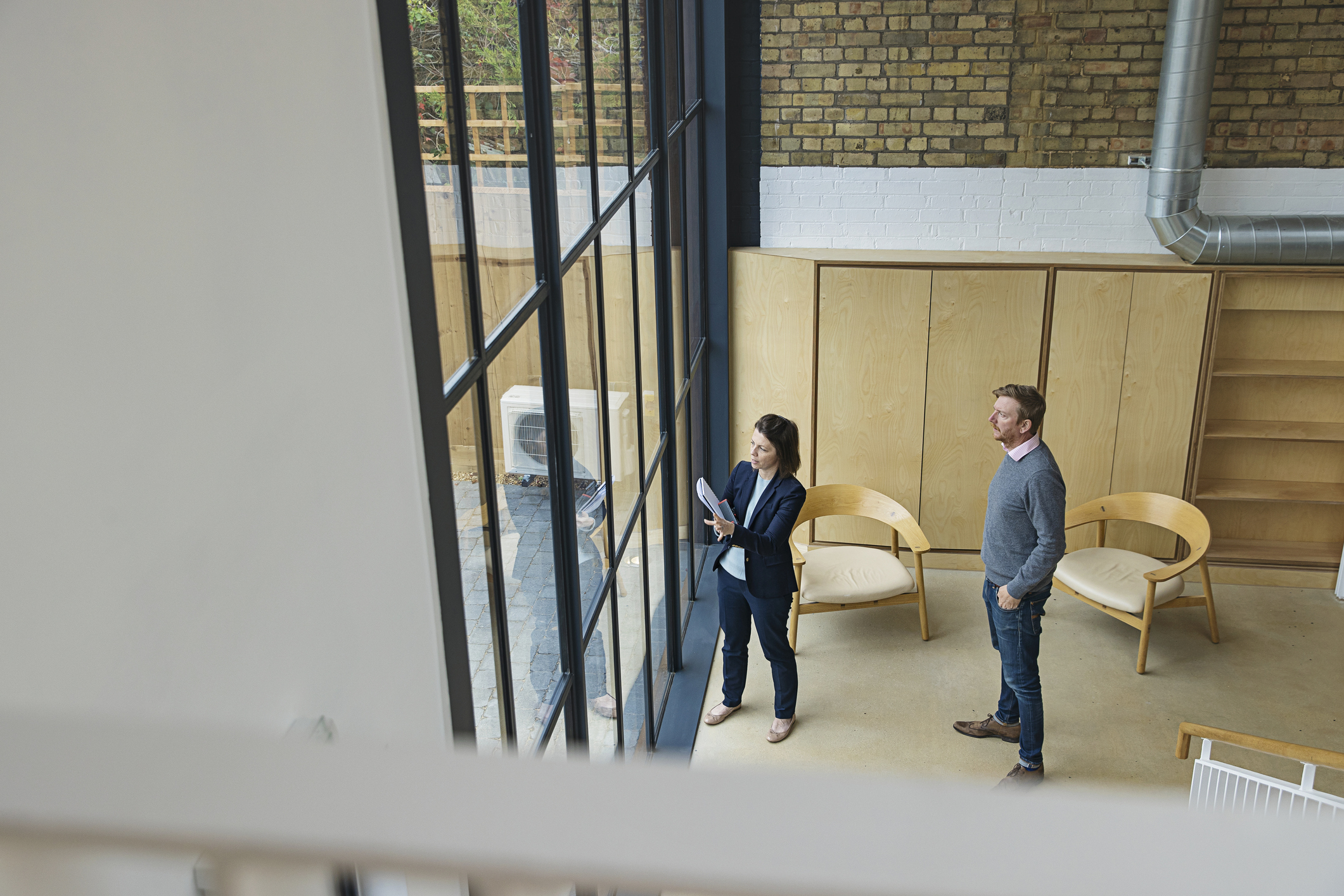 Real estate agent showing customer a commercial property Real estate agent showing a customer a commercial property.