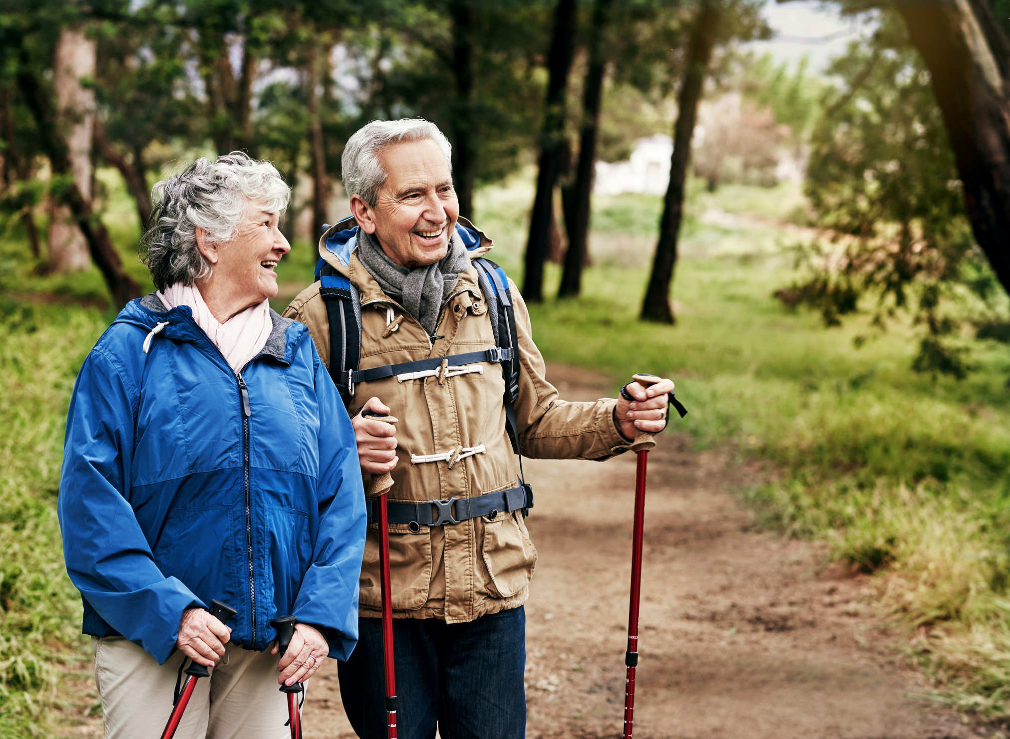 Retired couple hiking on trail