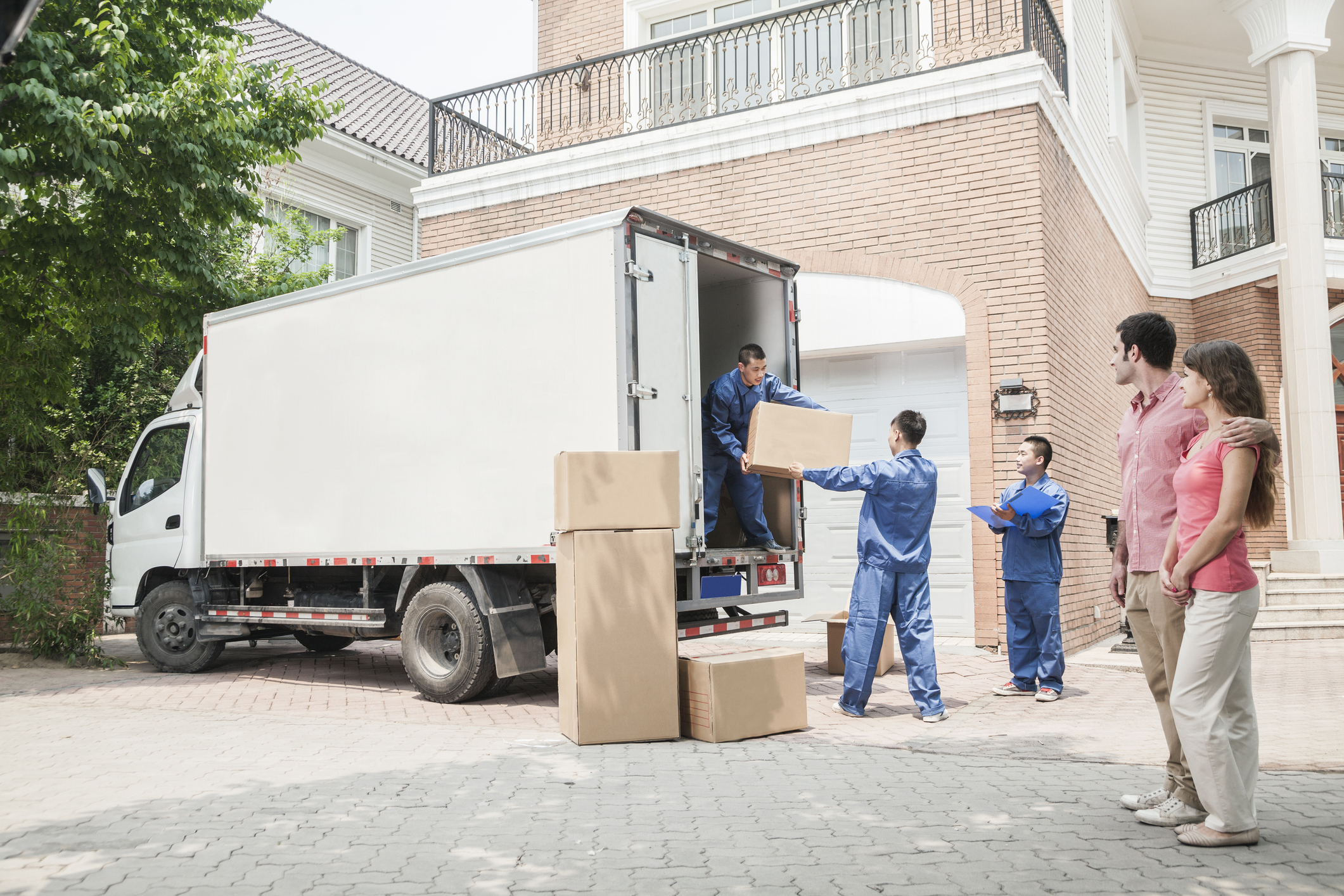People unloading a moving truck.