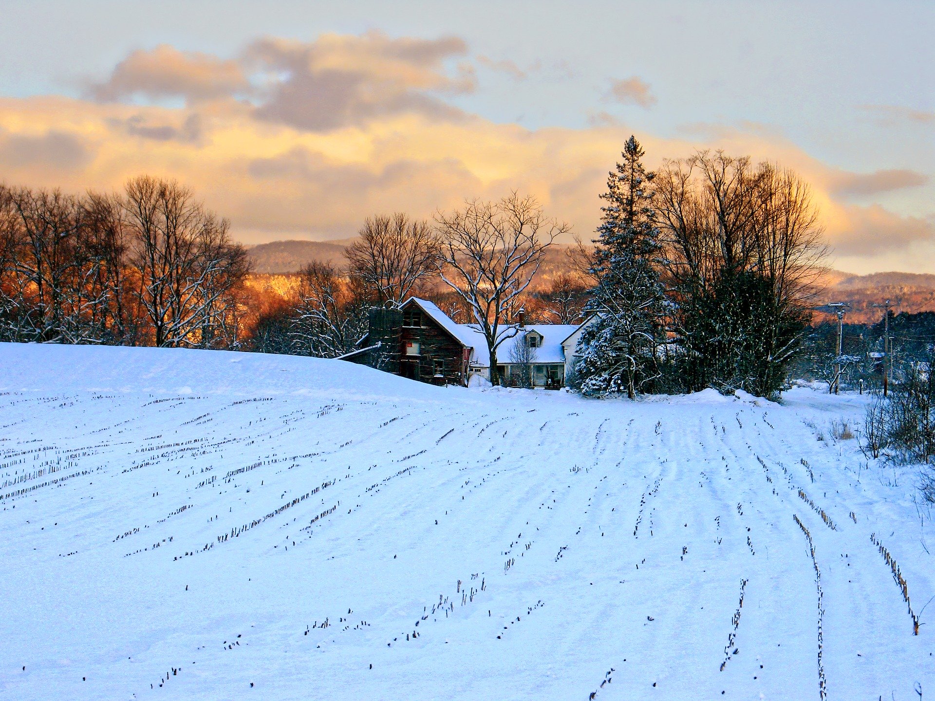 A rural farm blanketed in snow.