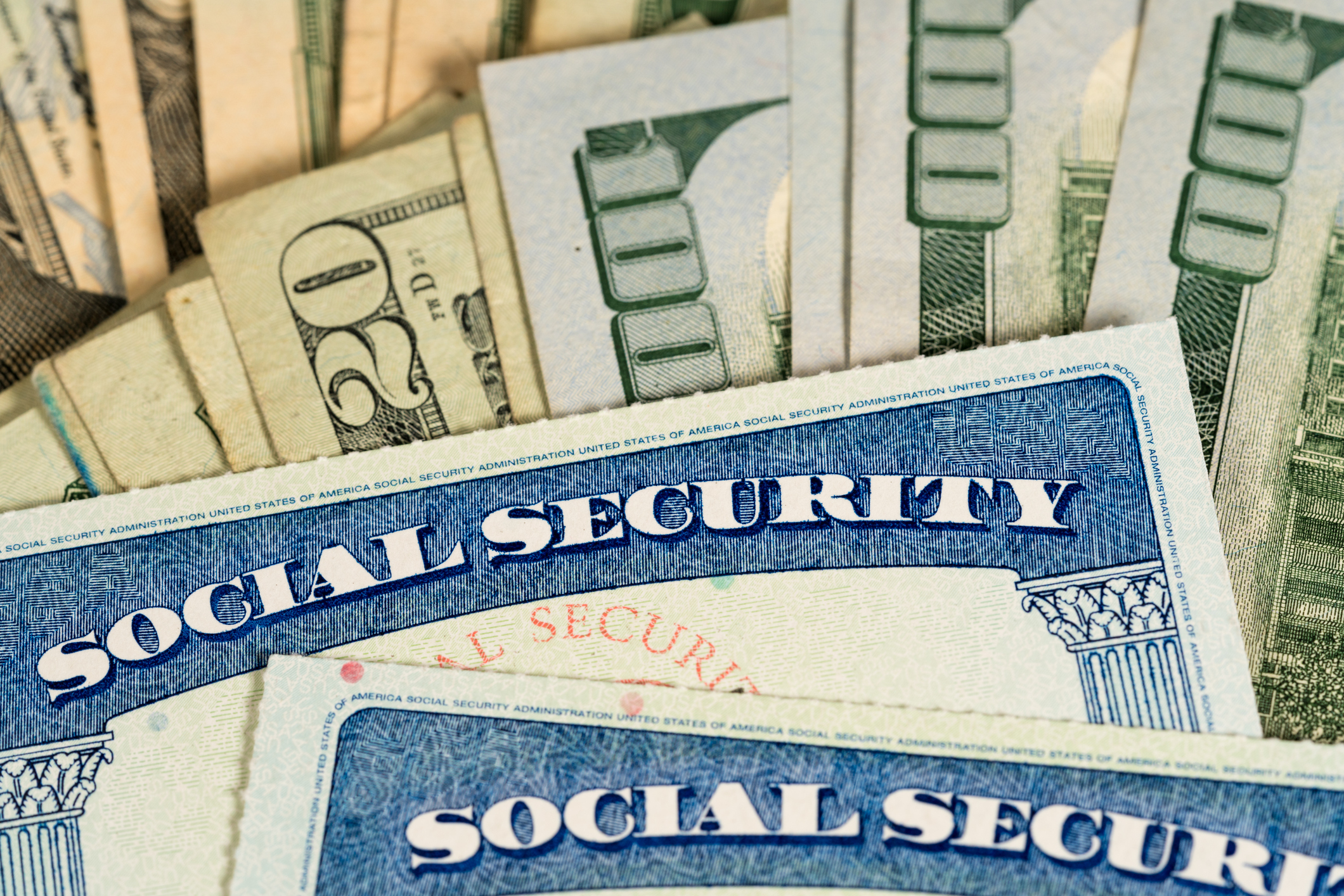Social Security cards on various bills