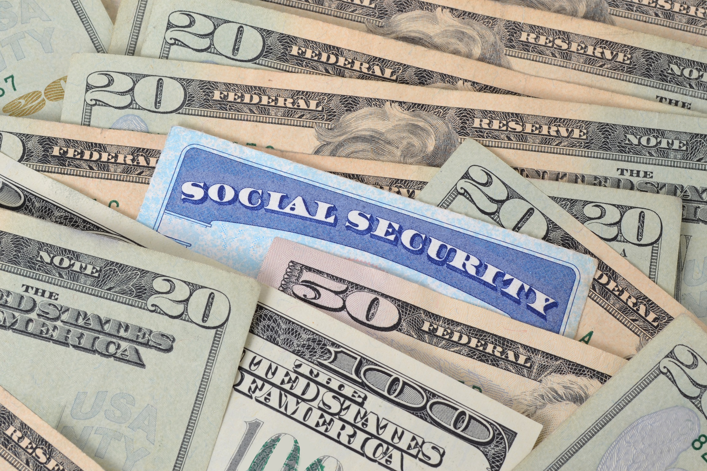 social security card and money Social Security cards and money.