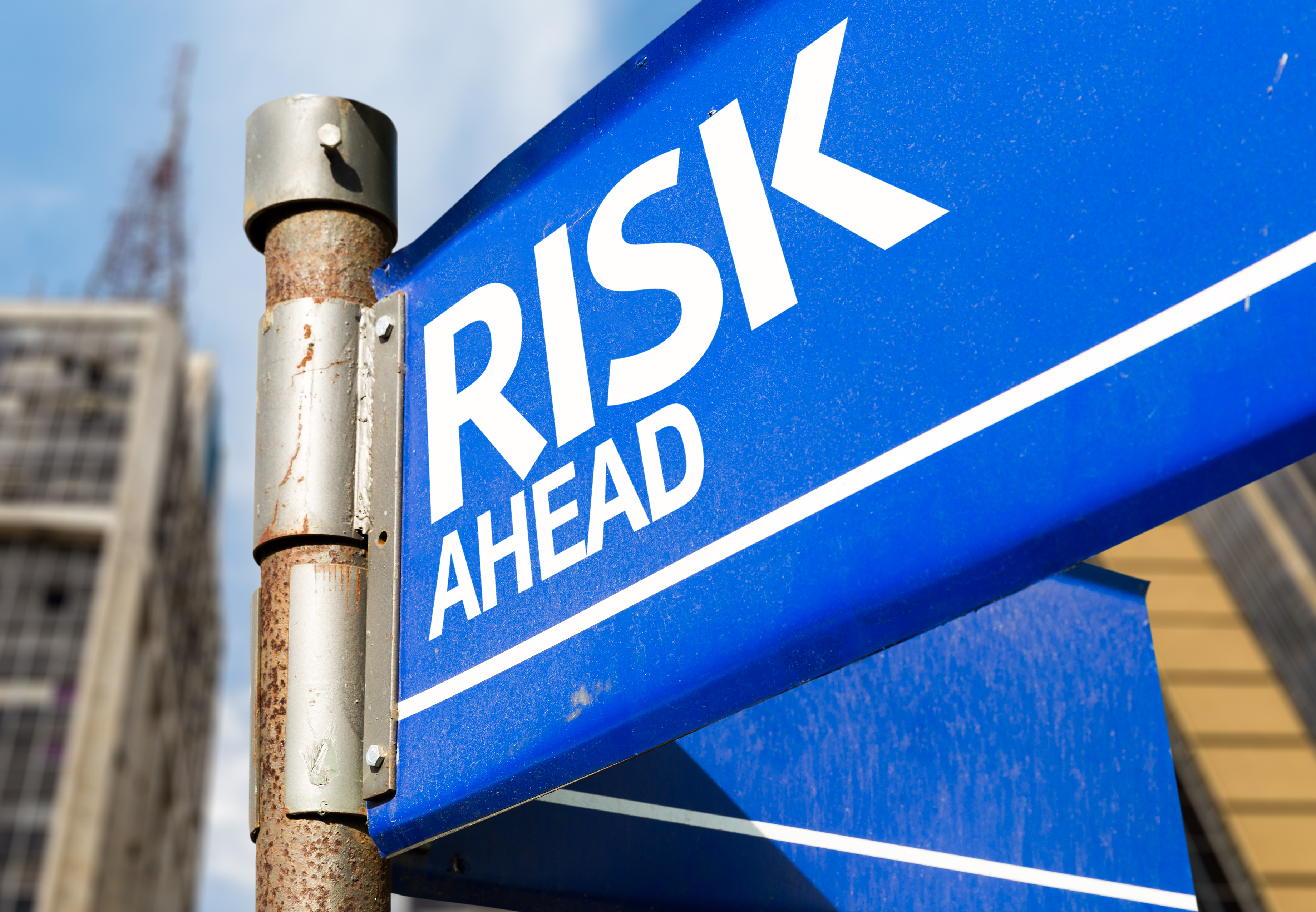 Blue risk ahead sign