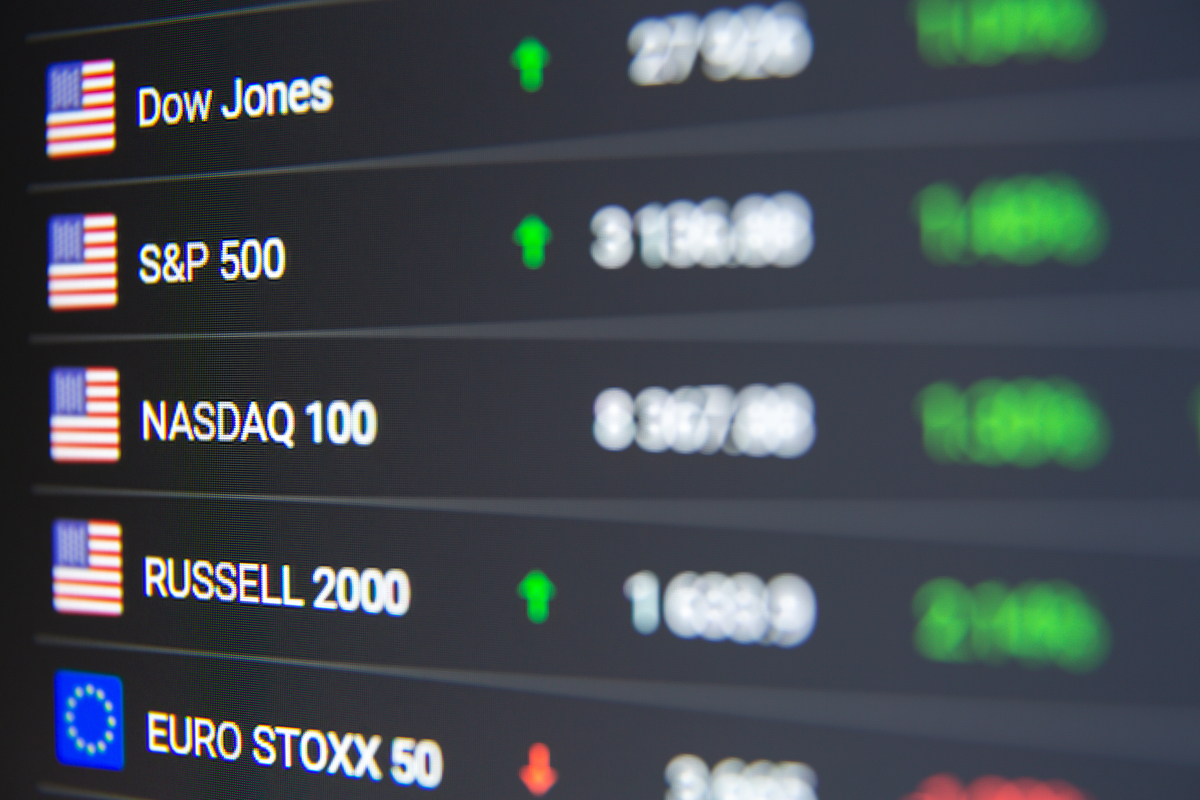Stock market indexes A digital board displaying stock market indexes and what they're trading for.