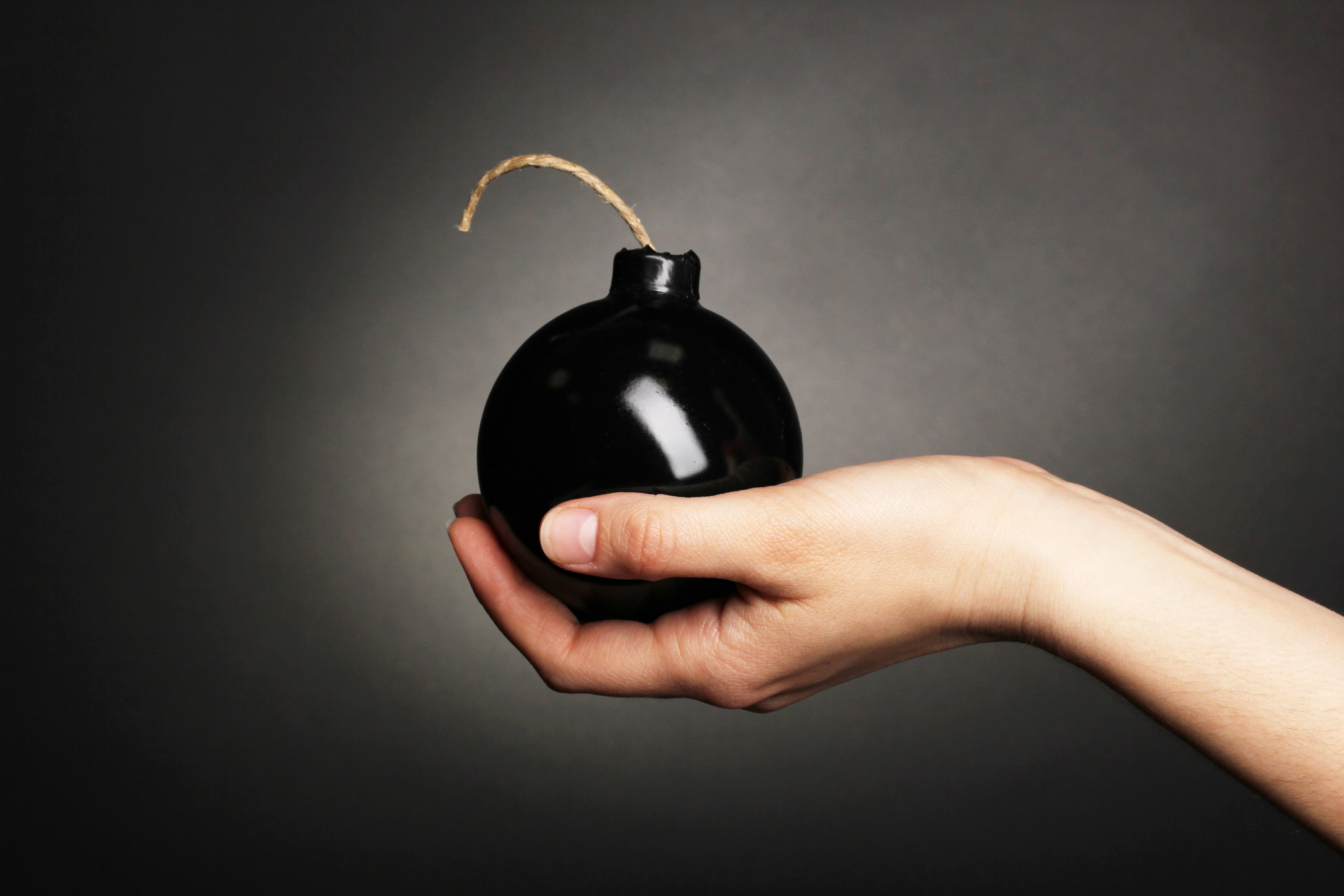 A hand holding a bomb