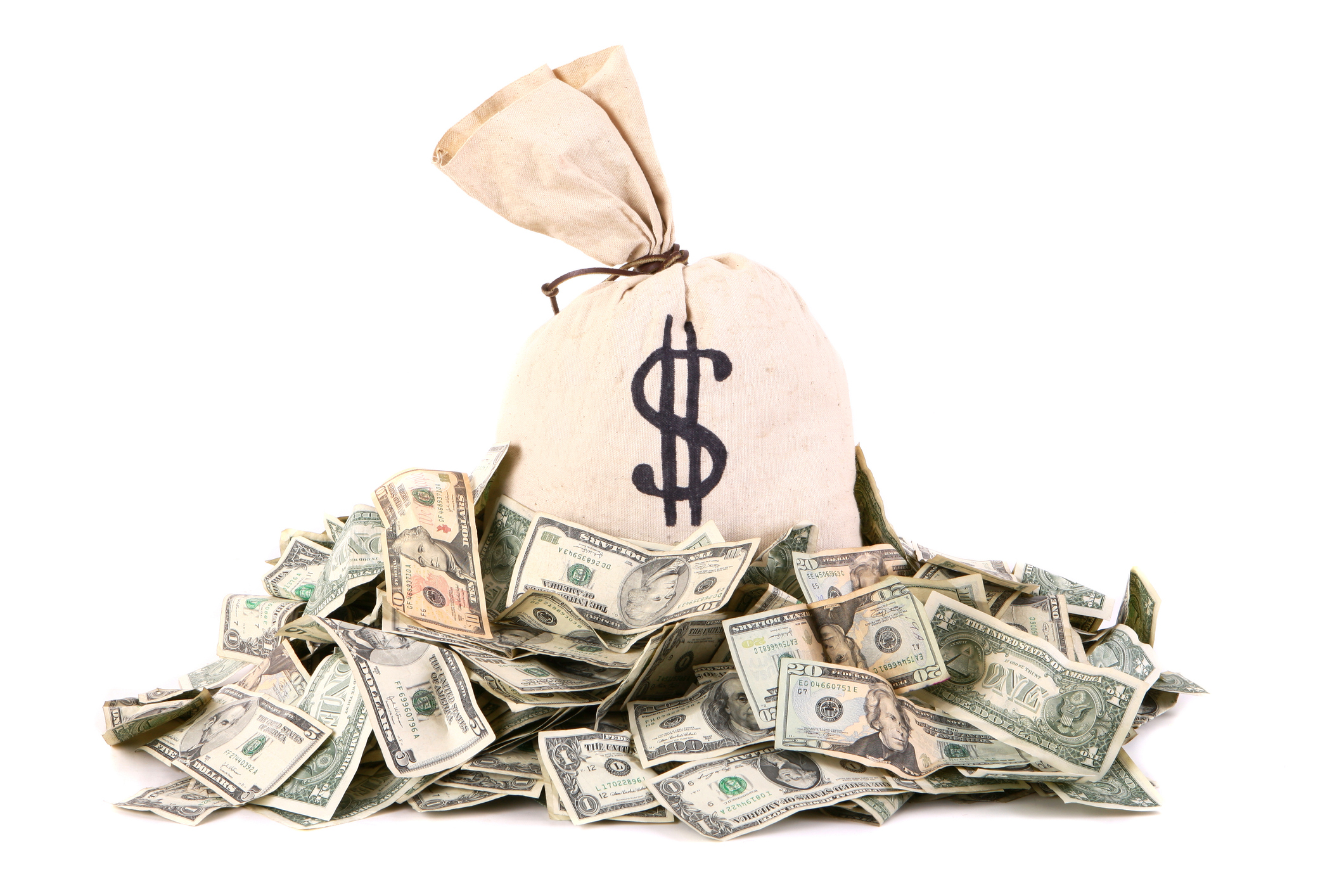 a money bag on a pile of cash a money bag on a pile of cash