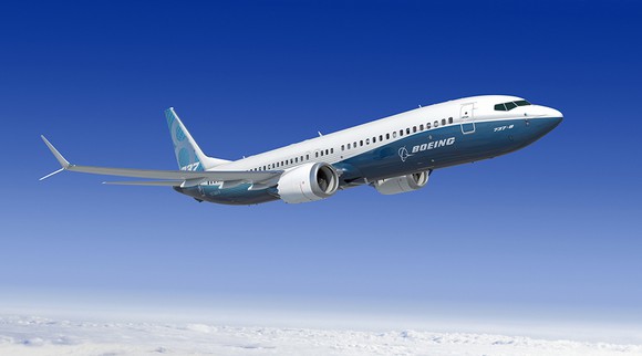 Boeing 737 flying in sky A Boeing 737 flying through the air.