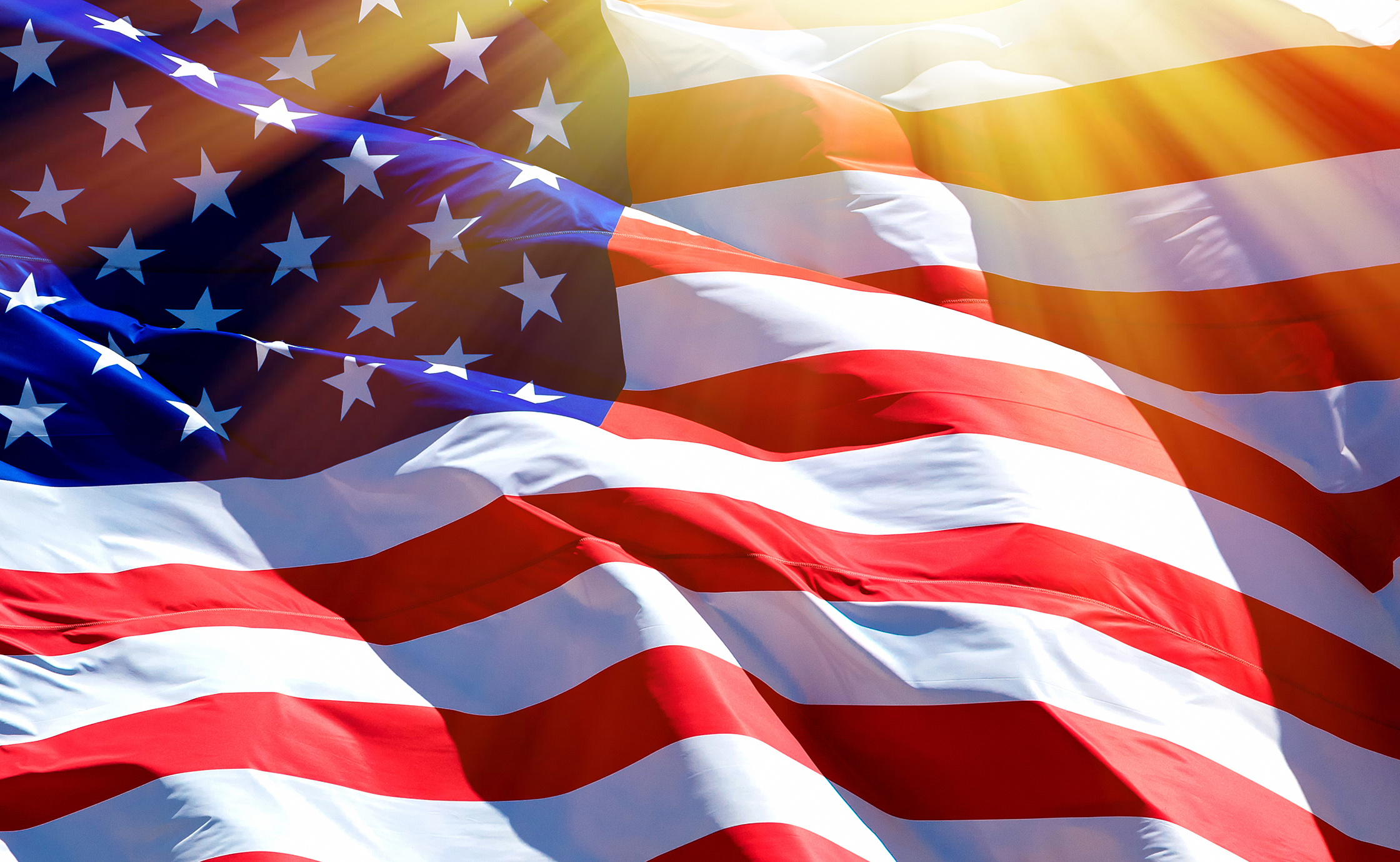 An up-close shot of American flag moving in the wind.