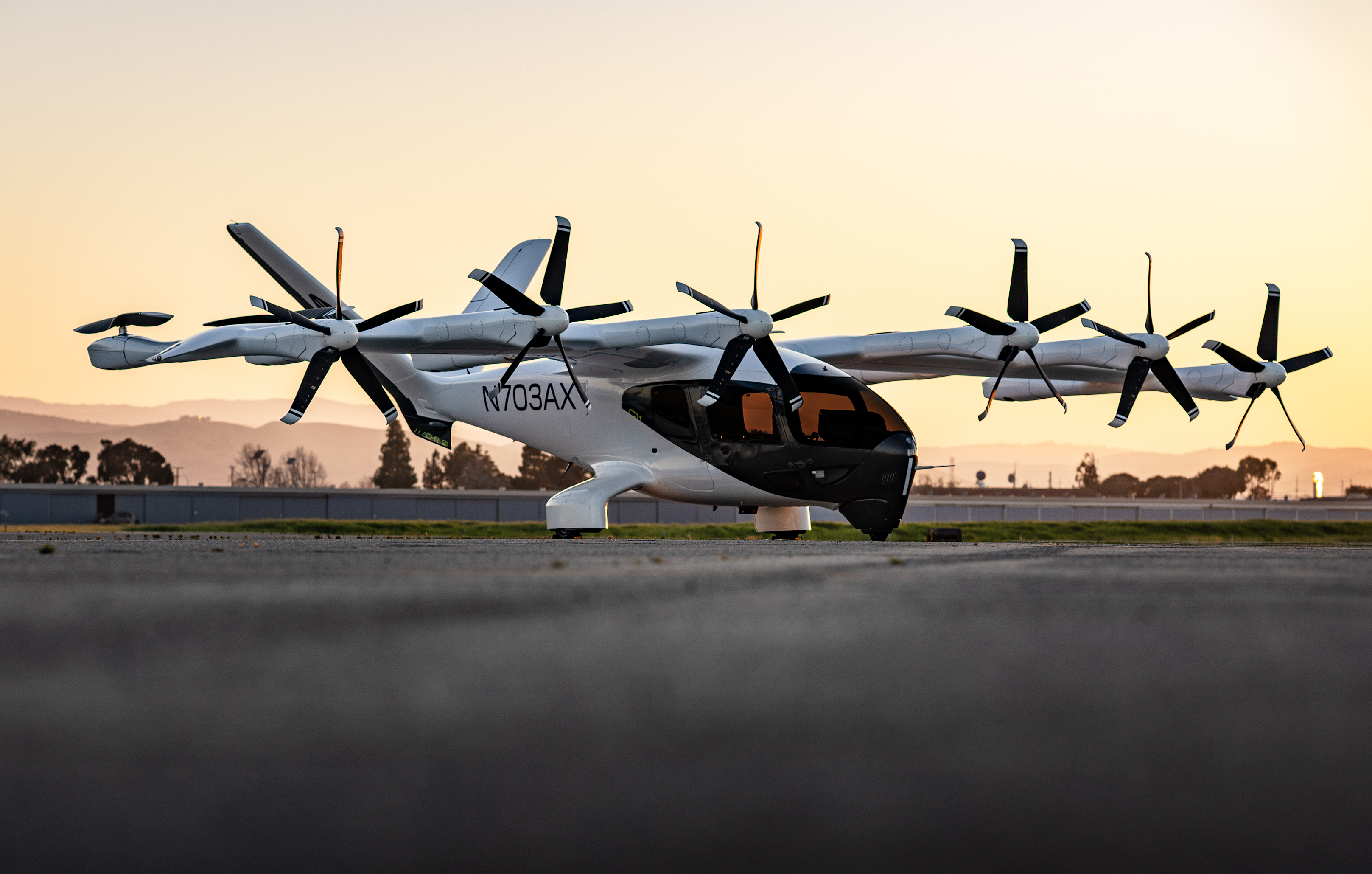 Archer Aviation eVTOL aircraft on the tarmac at sunset.