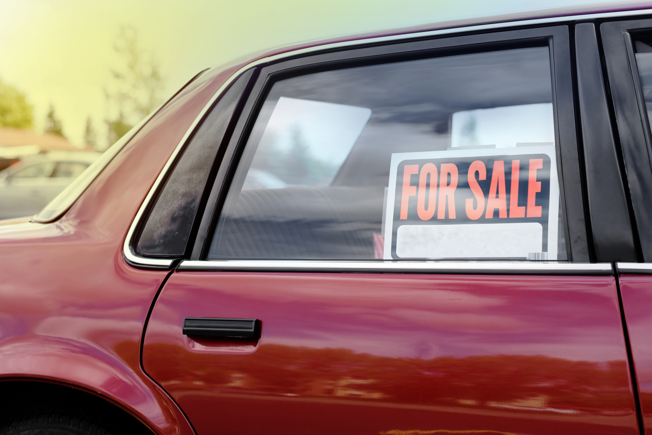 Car with a for sale sign in the window. Car with a for sale sign in the window.