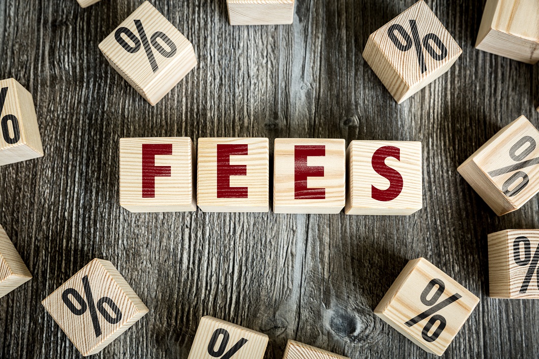 fees spelled out with blocks Blocks spelling out the word fees and surrounded by percentage signs.