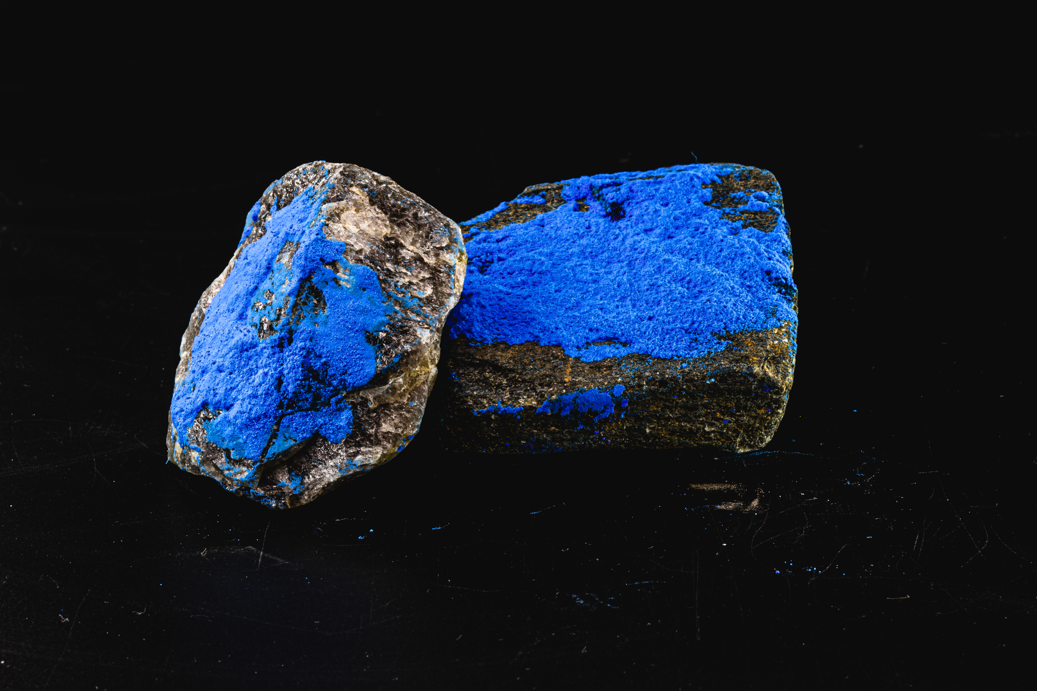 Raw blue cobalt ore Two pieces of blue cobalt ore.