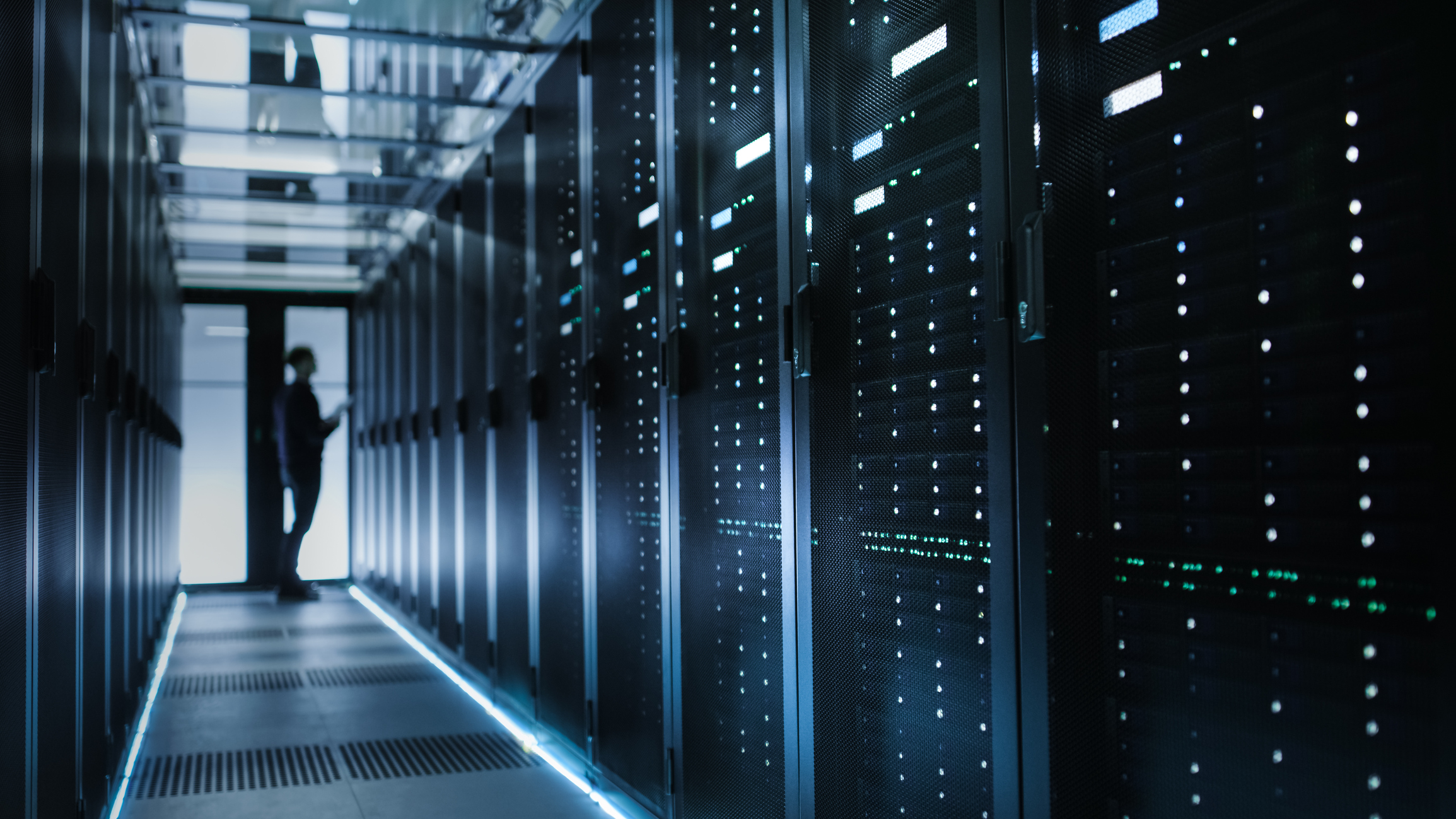 A dimly lit data center. A dimly lit data center.