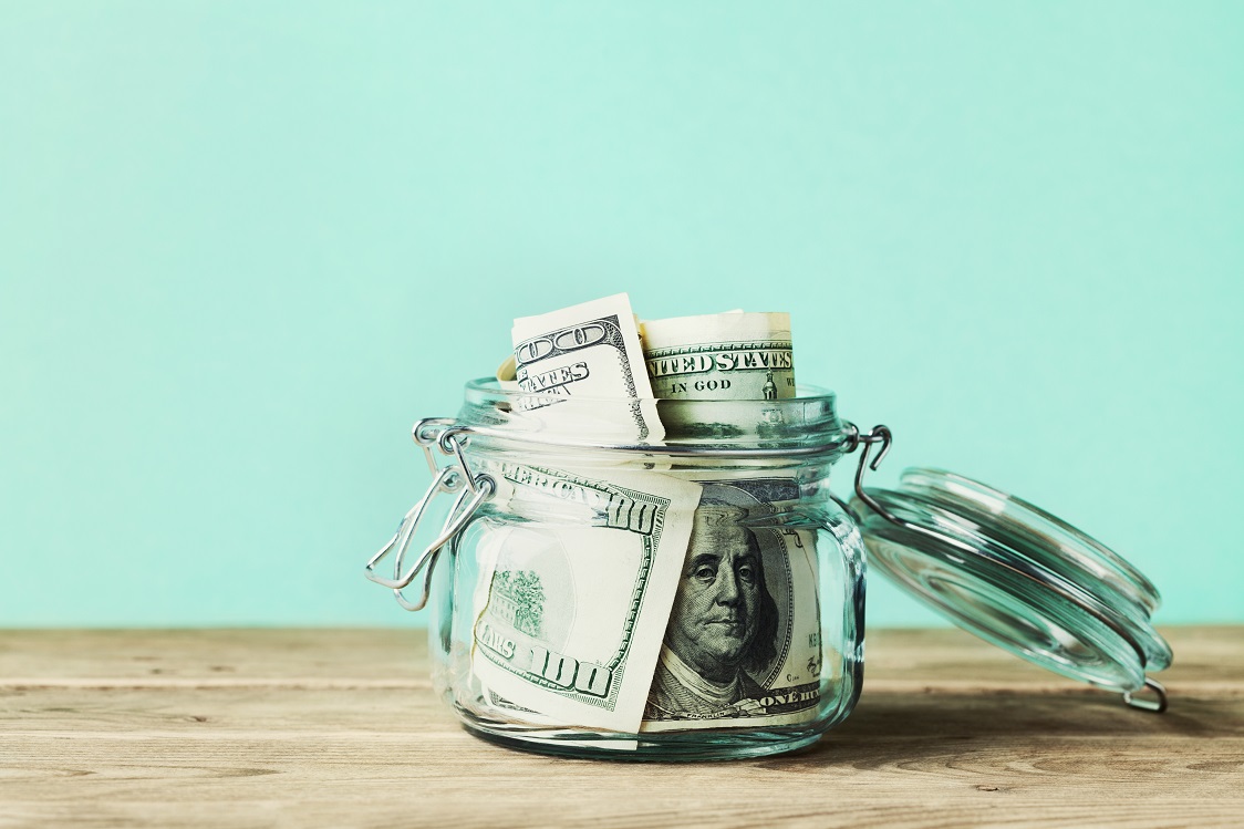 bills stored in a glass jar