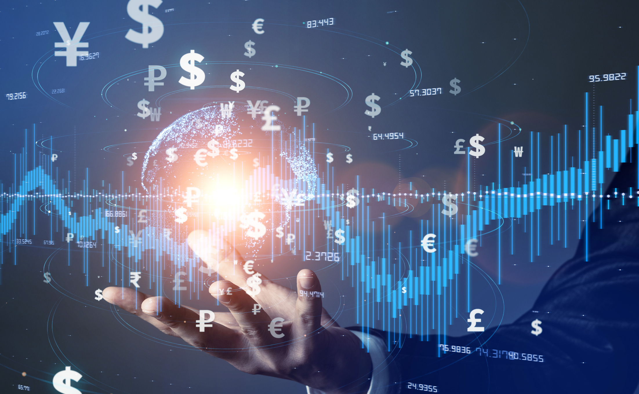 Fintech and global currency symbols A hand with fintech and global currency symbols surrounding a stock chart floating above it.