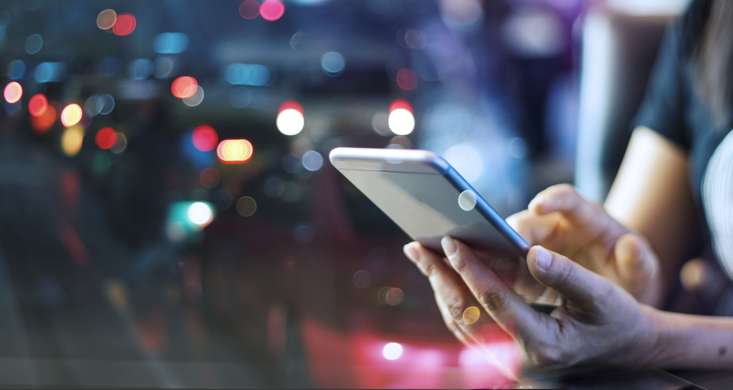 fintech payment app hands smartphone Person looking at a fintech payment app on a smartphone.