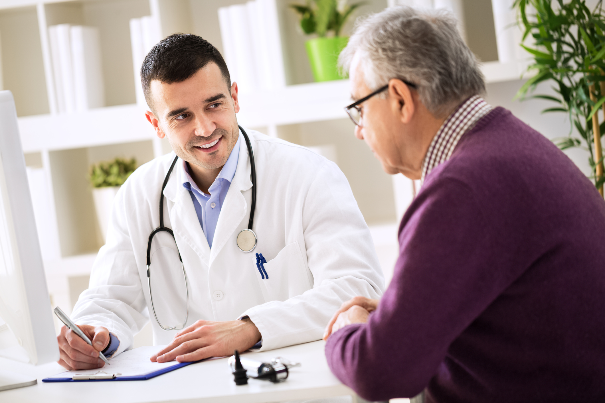 Patient with doctor Doctor speaking with patient.