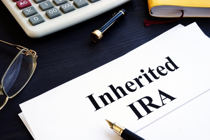 Inherited IRA documents on a table. Retirement plan. Inherited IRA documents on a table. Retirement plan.
