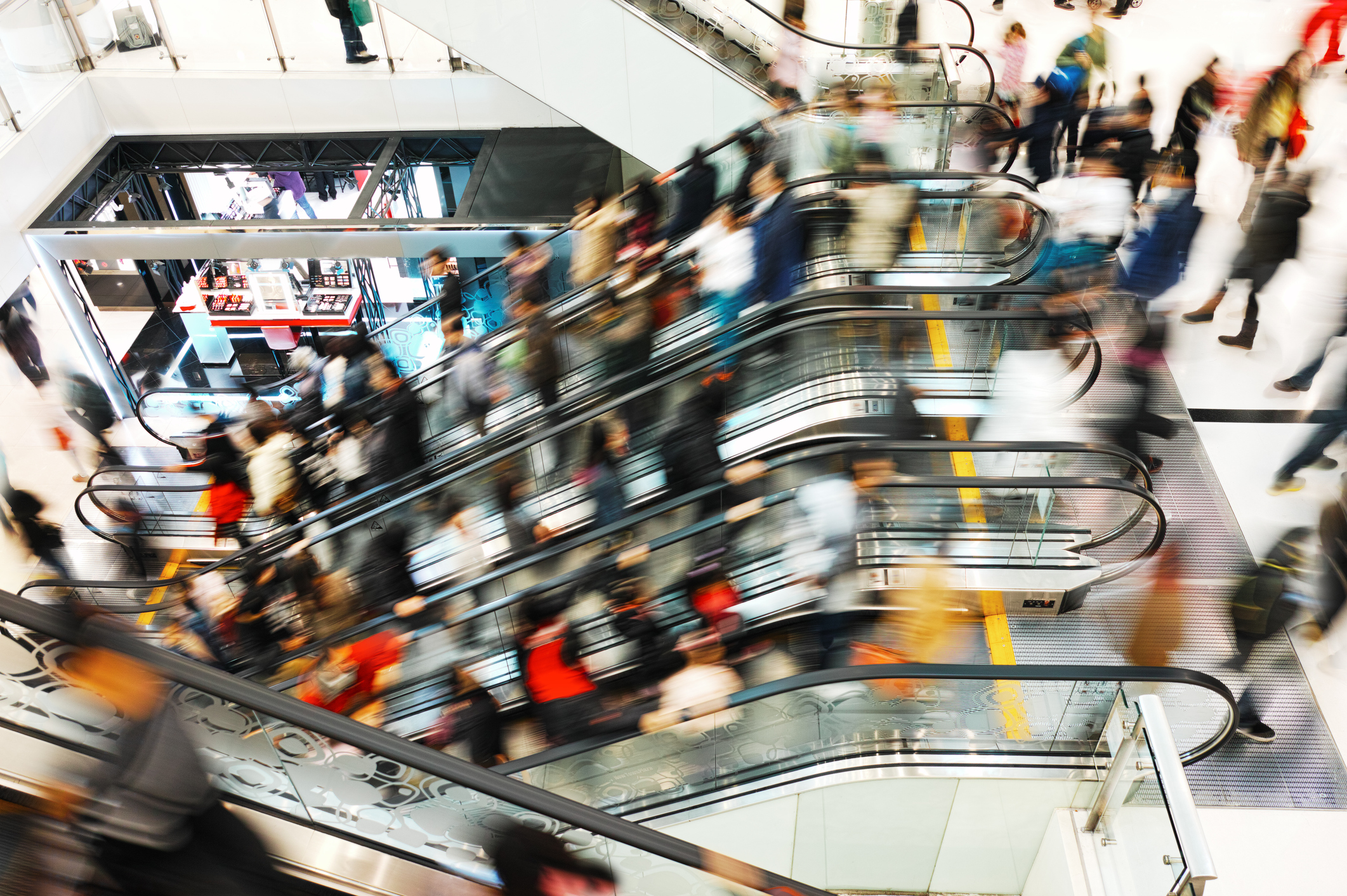 overhead blurred view of a busy shopping mall