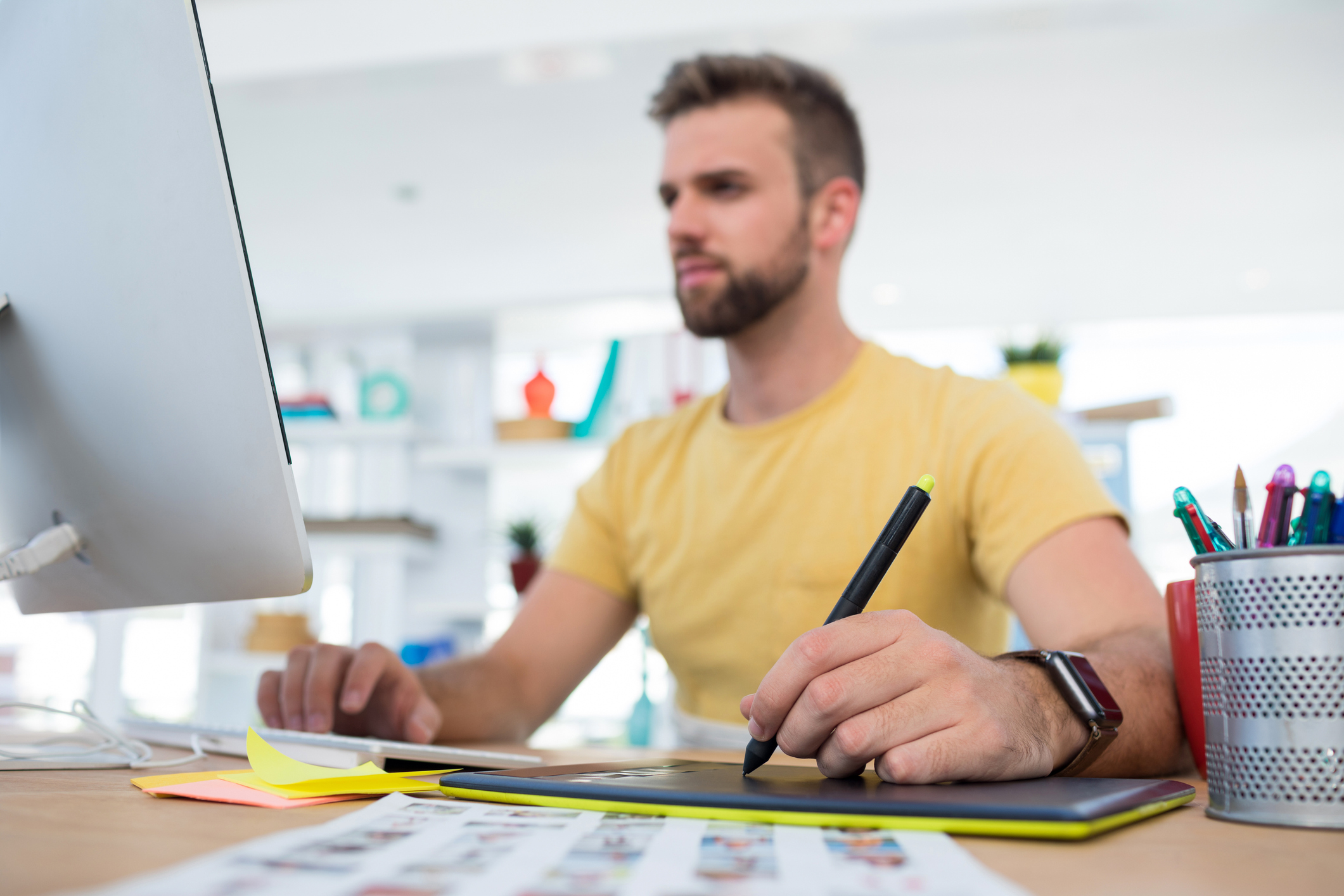 Person at computer taking notes. Person at computer taking notes.