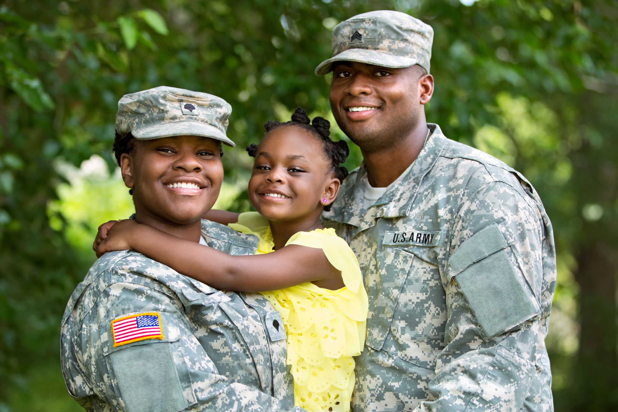 military couple family kid Military couple holding their child.