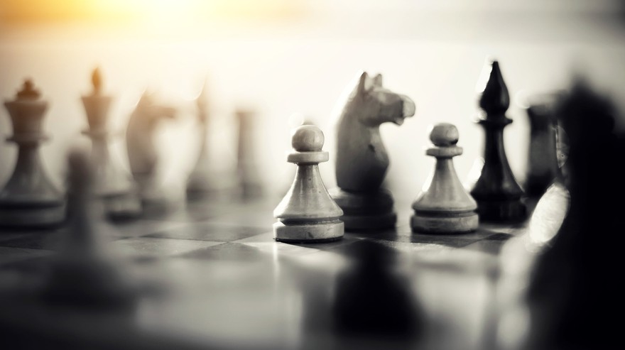 chess pieces on a chess board in the middle of a game chess pieces on a chess board in the middle of a game