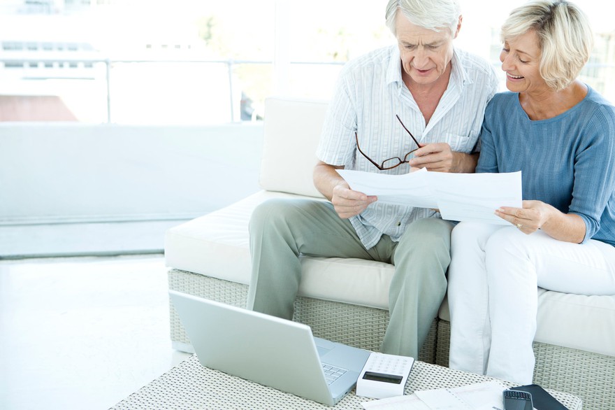 Older couple looking at documents. Older couple looking at documents.