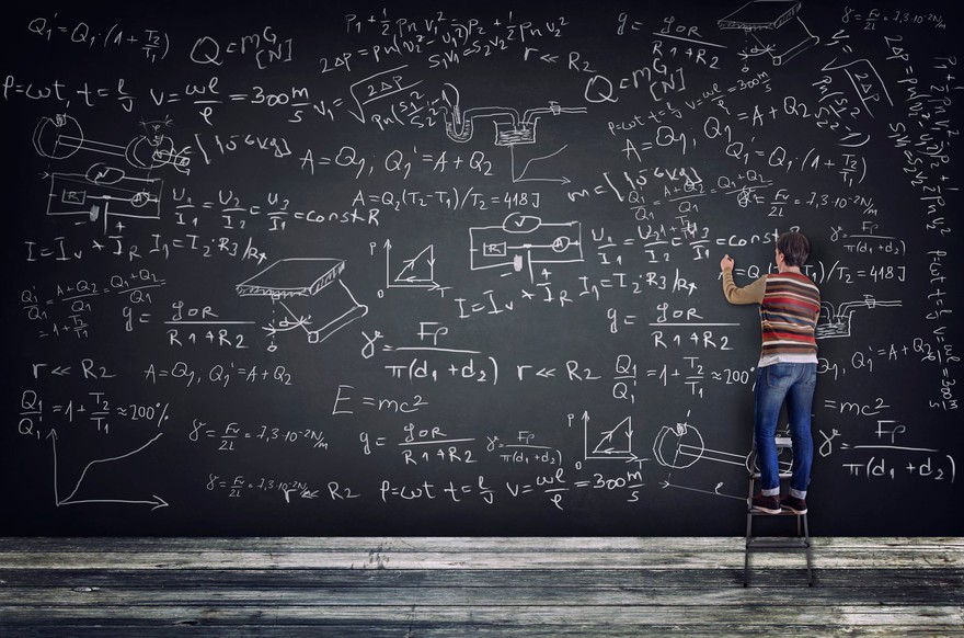 Someone writing a complex mathematical equation on a chalk board. Someone writing a complex mathematical equation on a chalkboard.