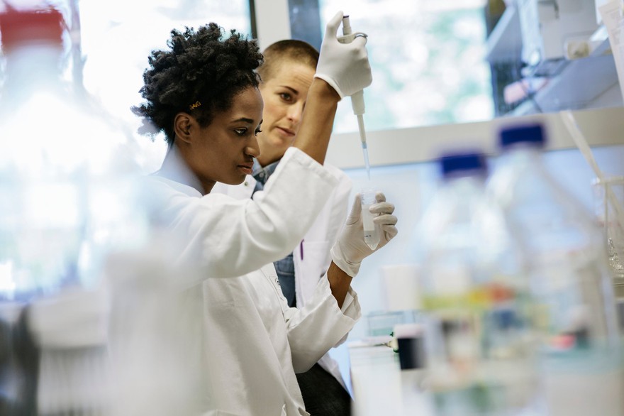 Scientists working on R&D in a lab. Scientists working on research and development in a lab.