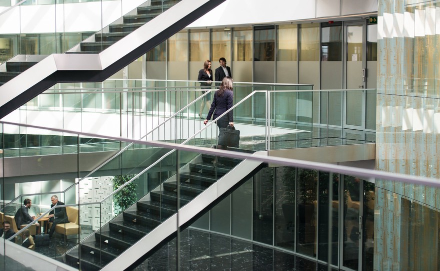 institutional investors walking around a large building