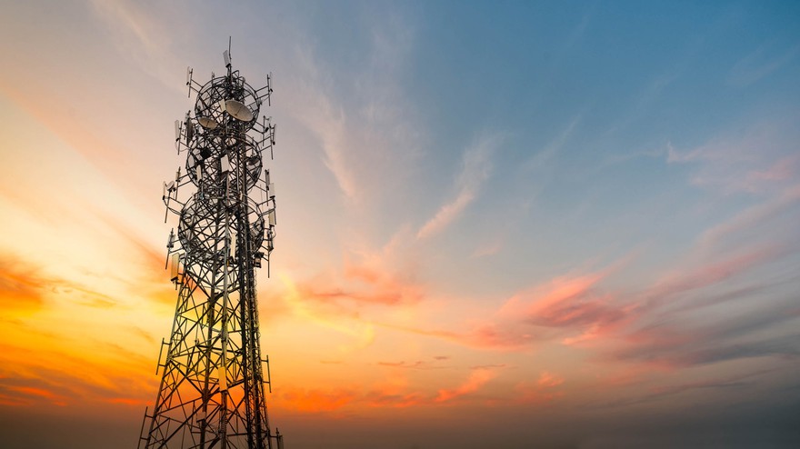 A telecommunications tower at sunset. A telecommunications tower at sunset.