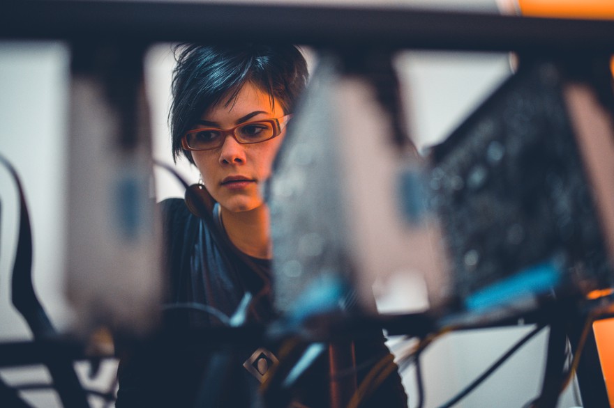 Someone looking at their cryptocurrency mining rig. Someone looking at their cryptocurrency mining rig.