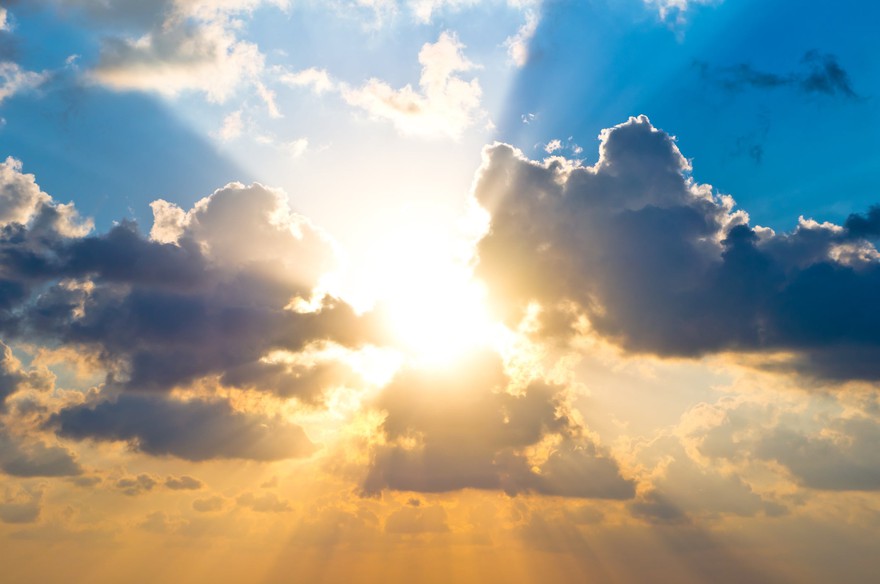 The sun shining through clouds. The sun shining through clouds.