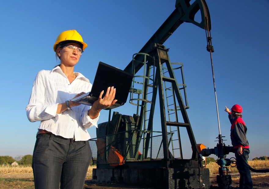Two engineers work in an oilfield. Two engineers work in an oilfield.
