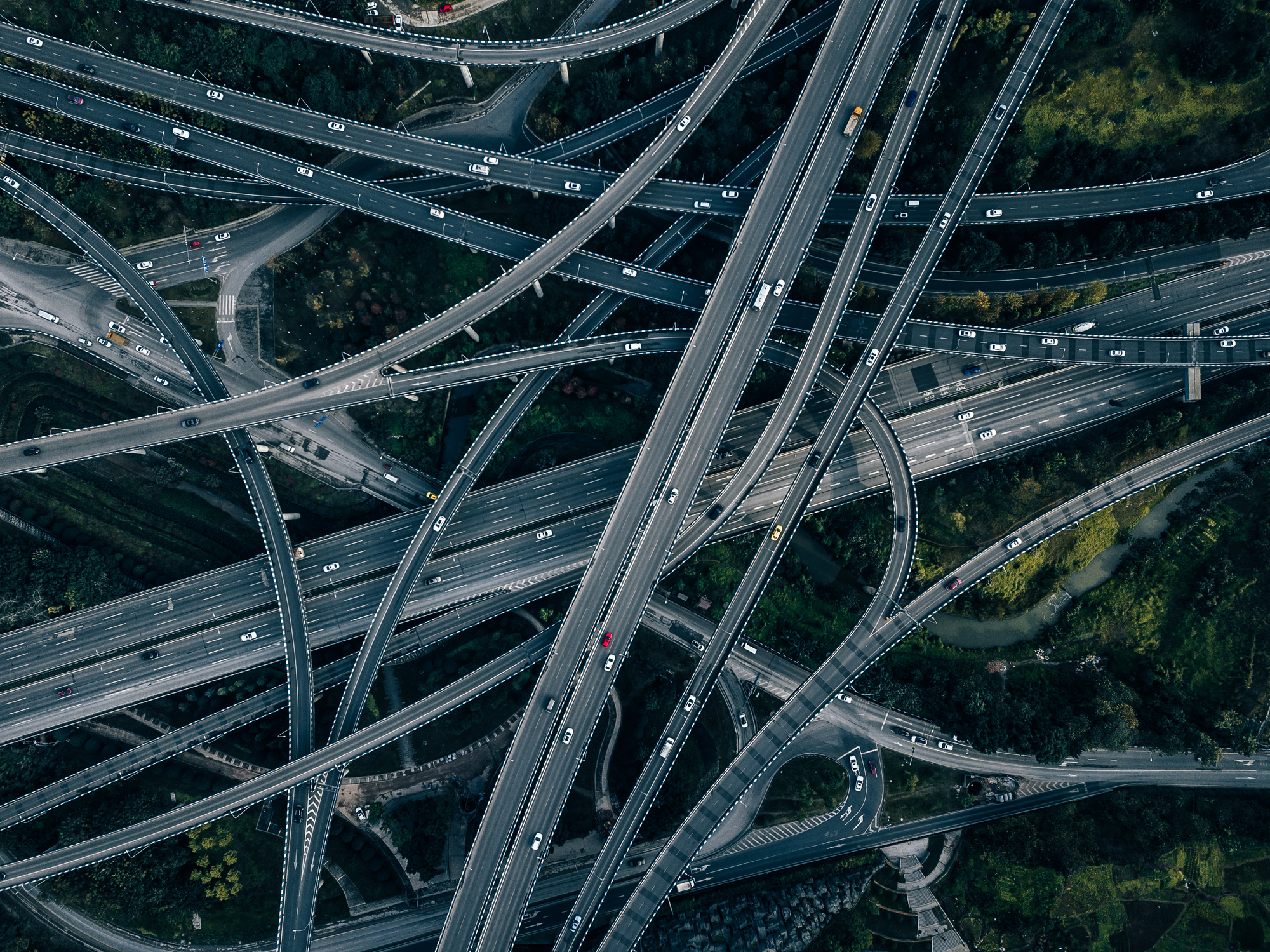 overpass traffic infrastructure An aerial view of interwoven highways and overpasses.