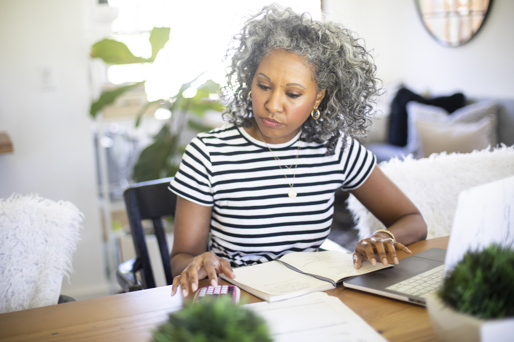 retired woman financial planning budgeting calculator