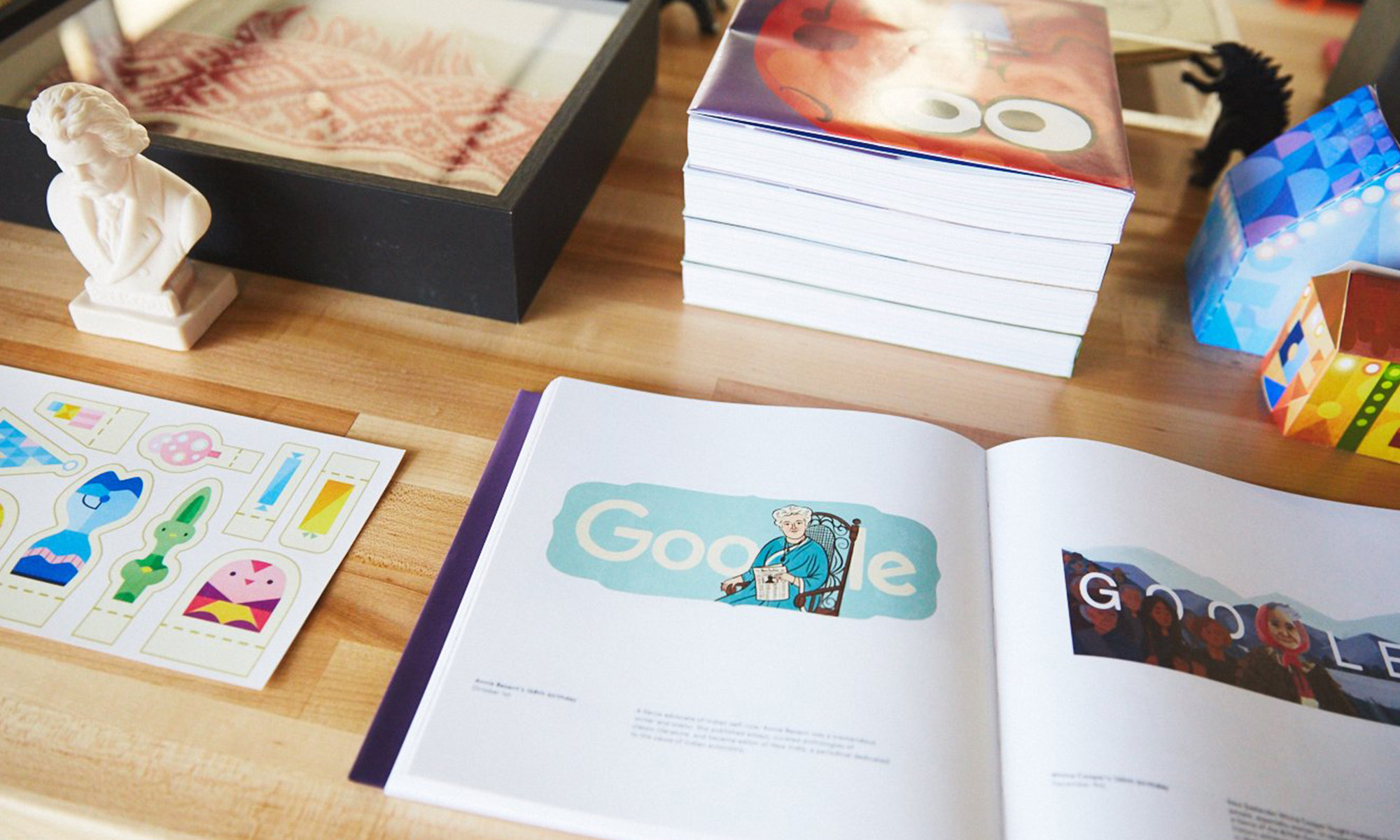 A snapshot of a book containing Google Doodles with the Google logo.