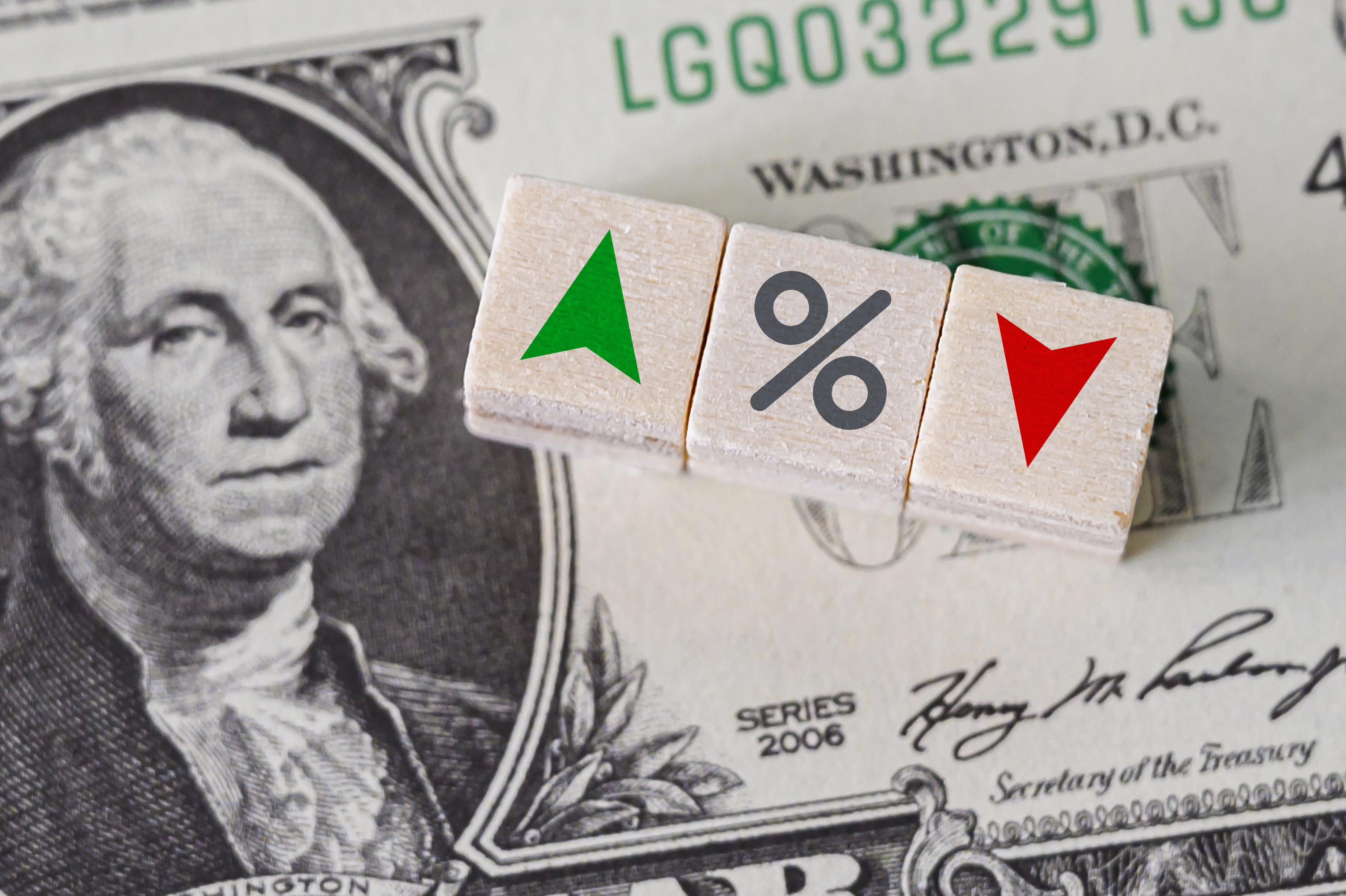 Depiction of interest rates with dollar bill and blocks with up and down arrows and percent symbol Depiction of interest rates with dollar bill and blocks with up and down arrows and percent symbol.