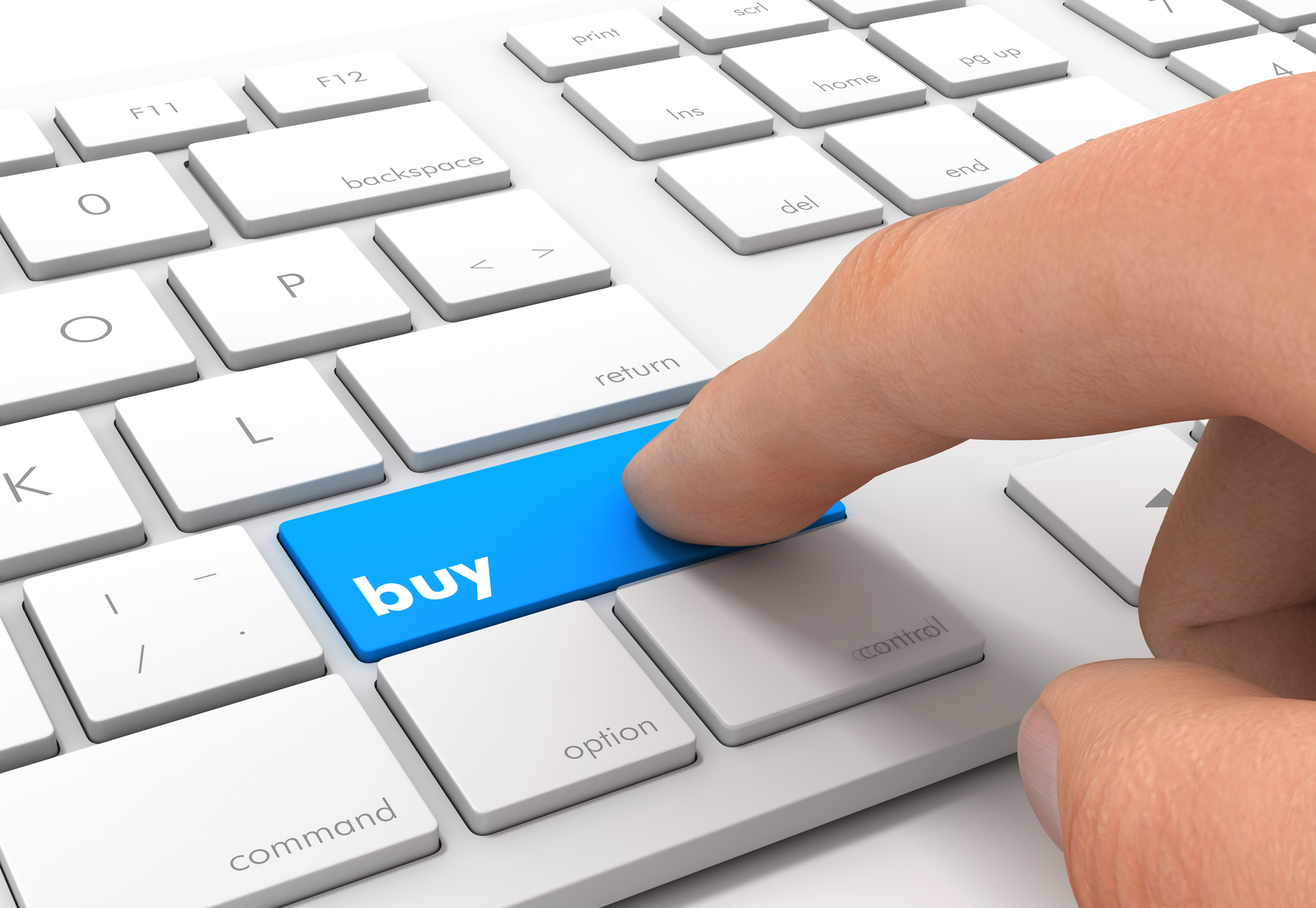 Finger pressing buy button on keyboard Finger pressing buy button on keyboard