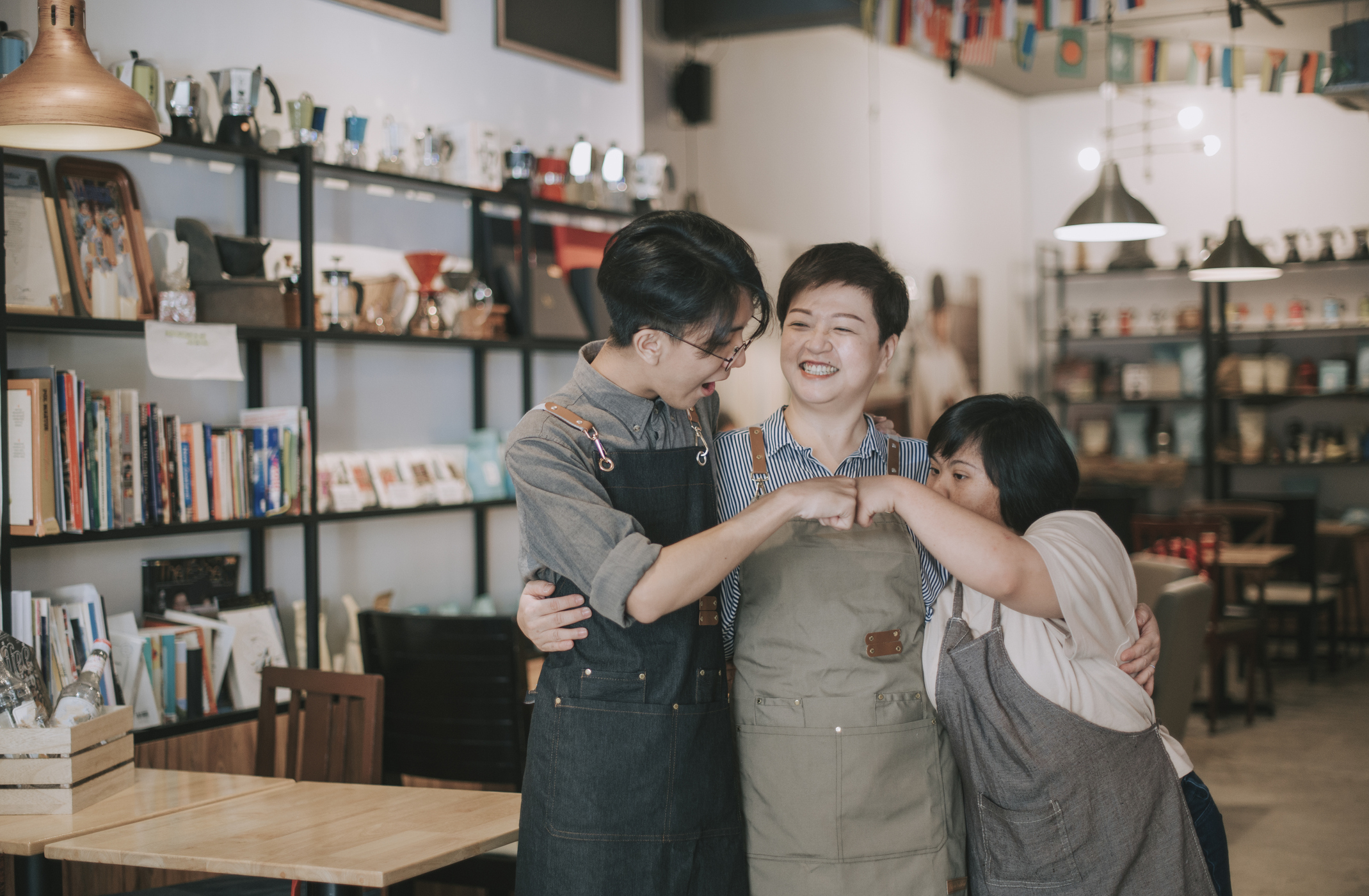 small business 3.jpg Three people in a small mom-and-pop retail shop.