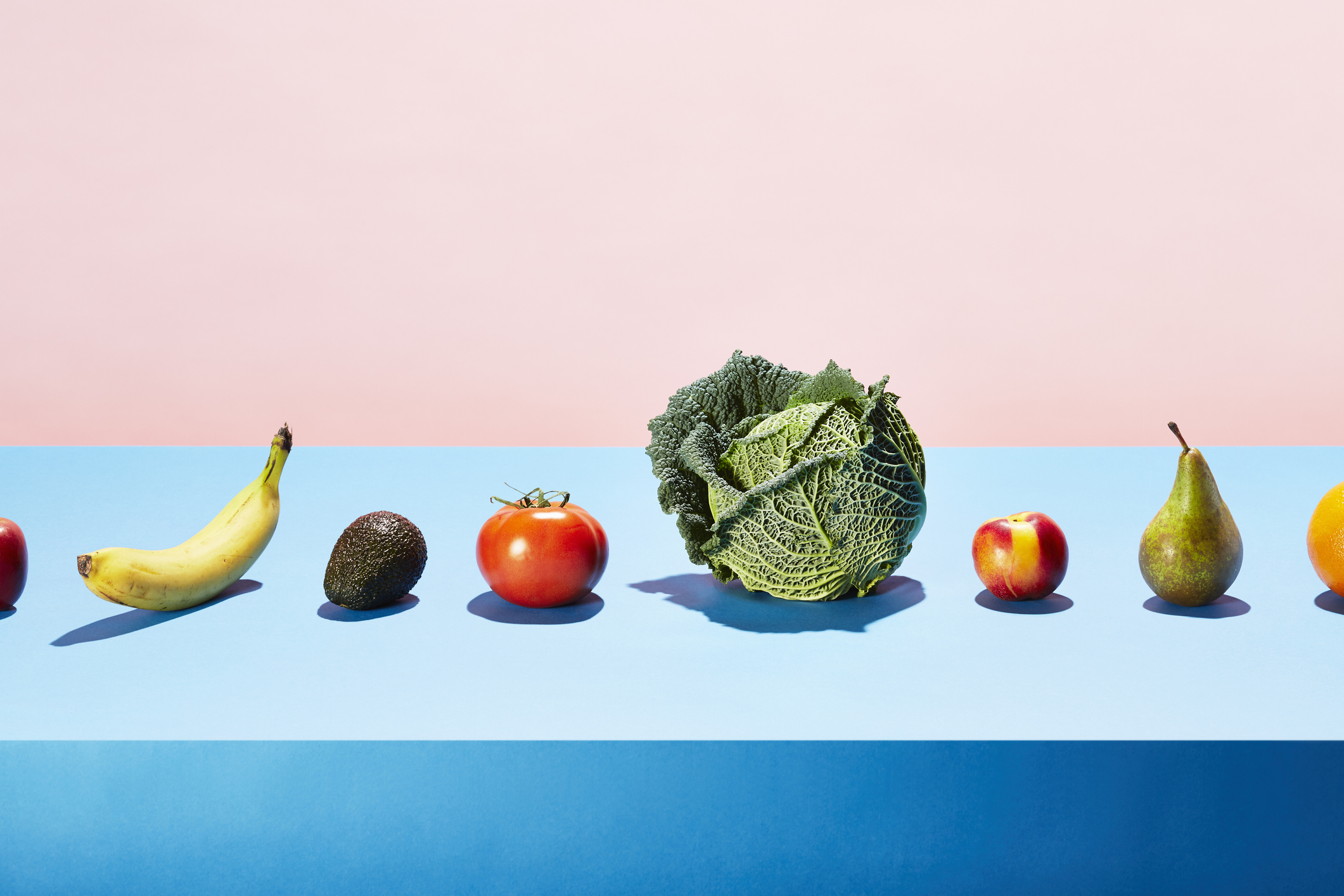 vegan foods, all types of fruits and vegetables lined up.jpg Vegan foods, all types of fruits and vegetables lined up on a blue table.