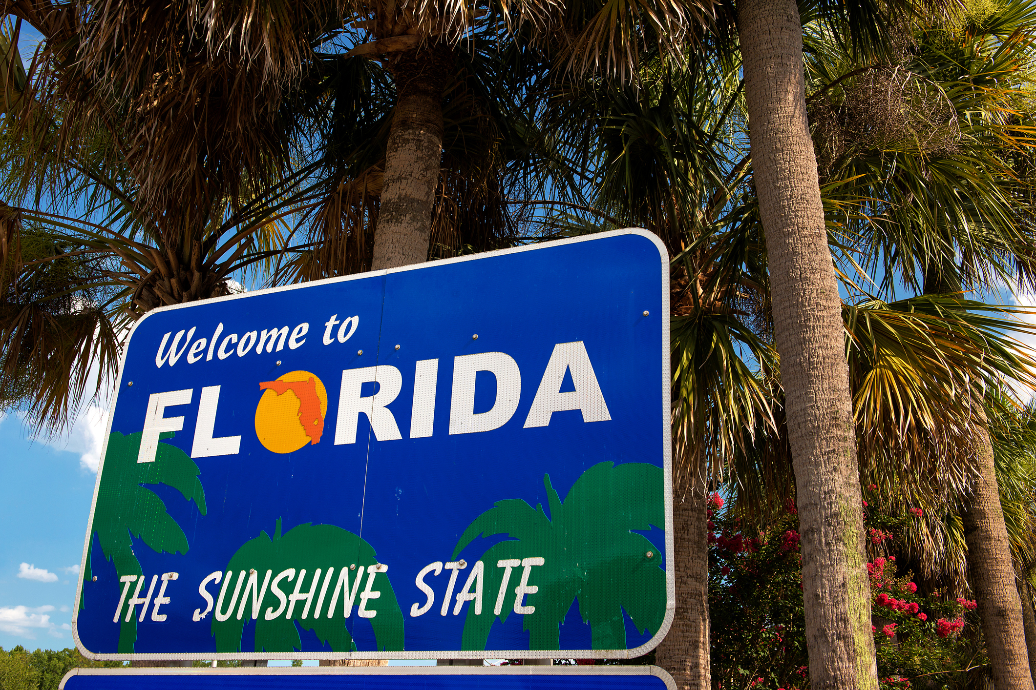 Florida Highway sign that says Welcome to Florida, the Sunshine State.