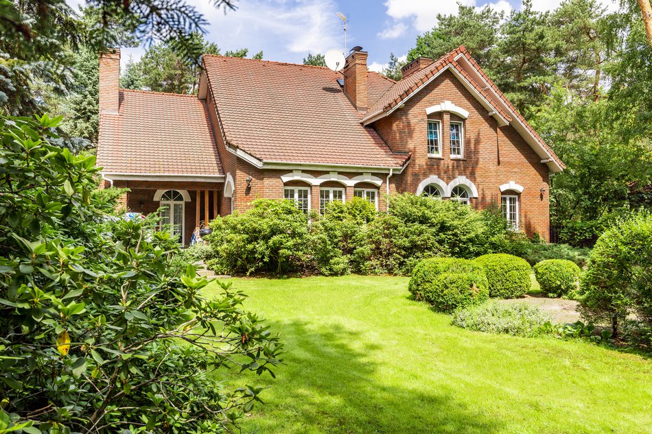 house with green lawn