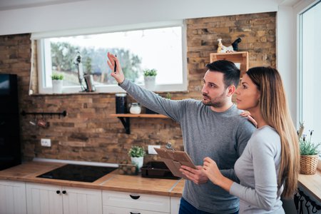 couple looking at a kitchen
