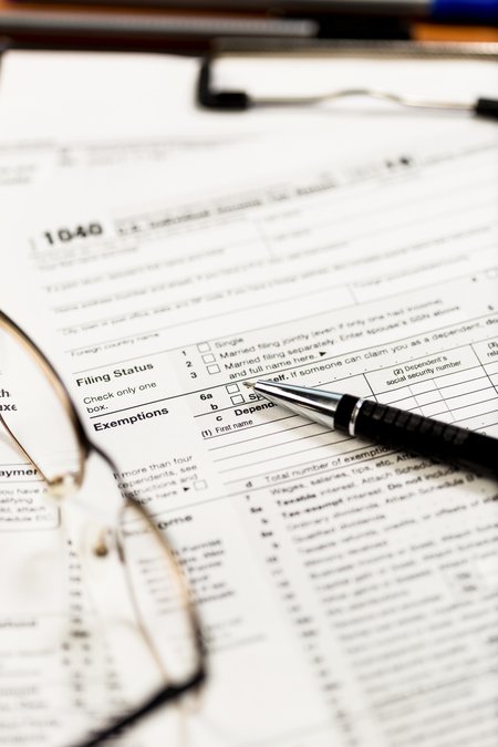 glasses with tax forms