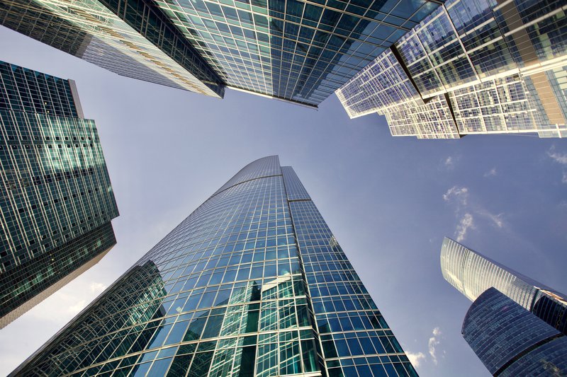 looking up at skyscrapers