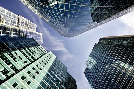 looking up at skyscrapers