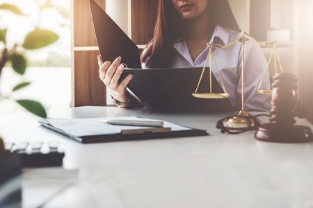 woman looking at legal documents