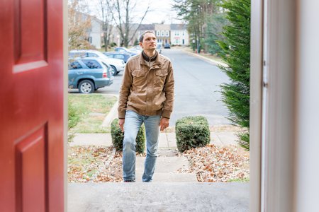 man looking at door